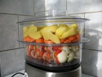 Cut peeled potatoes and chop trimmed fresh carrot...