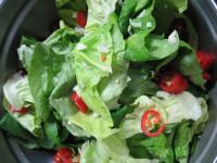 Cut the salad into smaller pieces, add chopped...