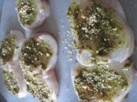 Cover each slice evenly with pesto, season with...