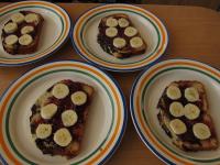 Spread jam over the cake layers and place bananas...