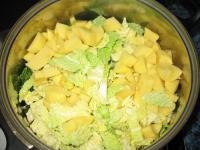 In a large saucepan saute the onion, kale and...