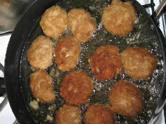 From the mixture form oval burgers and coat with...