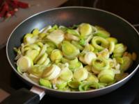 Cut two medium-sized leeks into slices and fry in...