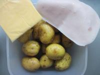 Boil the potatoes in their peels in salt water....
