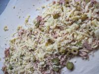 Crumble tuna pieces on one half of the puff pastry...