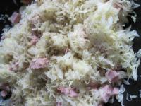 Cook onion in oil, add sauerkraut and cooked...