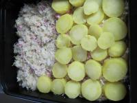 Grease baking pot with oil, lay in mixture from...