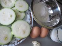 Prepare coating batter by mixing flour, eggs and...