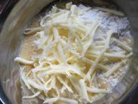 Mix egg, flour, milk, grated cheese and pressed...