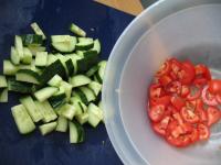Wash tomatoes and cucumber, cut them into cubes. ...