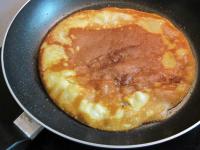Pour a dough onto a hot pan and help it to...