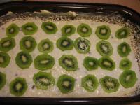 Grease baking tin with butter and pour oat flakes...