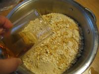 Pour crushed biscuits with rum. ...
