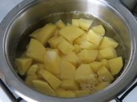 Brush potatoes, cut into a smaller cubes and put...