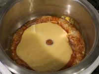 Slowly pour condensed milk from can into...