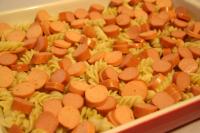 Spread half of the cooked pasta over the...