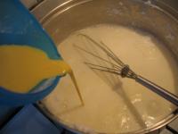 Add sugar into the milk in a saucepan. Blend egg...
