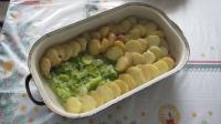 Place slices of potatoes over the leek....