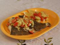 Place the fish on a plate, sprinkle with lemon...