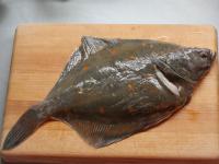 Wash the flounder and dry it. Check, if the fish...