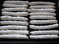 Put the wrapped sausages on a baking sheet rinsed...