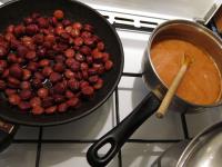 Cut the pork sausages into the rings, saute in...