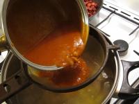 Strain cooked roux through the sieve into the...