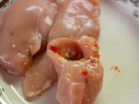 Cut the chicken breast lengtwise to create...