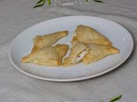 Moisture edges of the dough with water and stick...