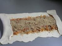 Add ground walnuts and start to roll. Fold shorter...