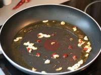 Peel the garlic and cut into thin slices. Clean...