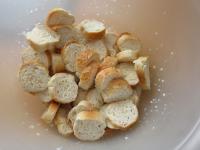 Cut bread rolls into the small wheels, place in...