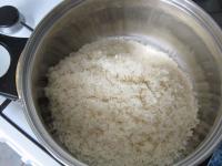 Rinse the rice under the running water, let it...