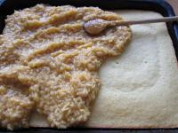 Spread cool gruel on top of the baked pastry. ...
