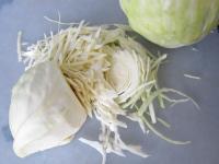 Remove damaged leaves from surface of head cabbage...