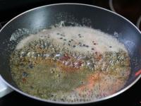 Add the brandy and burn the alcohol. ...