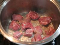 Fry the meat on a hot oil in a pan until brown,...