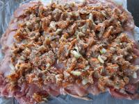 Spread filling evenly on the ham layer....