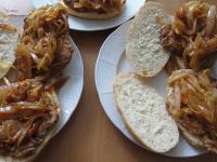 Spread roasted onion over the meat. Cover with...