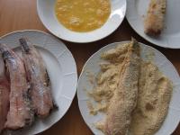 Dip the fish into the egg and then coat it in a...