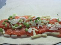 Roll pastry on a floured board.Lay salmon fillets...