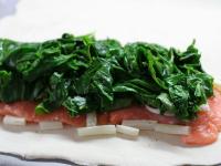 Put spinach leaves on salmon, cover it with second...