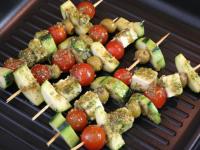 Place skewers on preheated grill pan or aluminium...