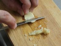 Crush the garlic clove. ...