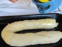 Carefully place the roll on greased baking tray...
