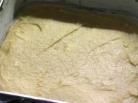 Spread the dough on the greased and floured tray....
