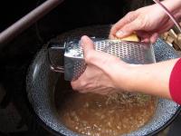Take the kettle from fire and coarsely grate the...