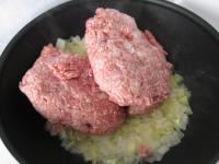 Add minced meat into the pan, ground black pepper...