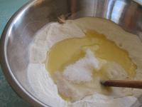 Pour flour in a bowl, make a small hole, crumble...