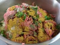 Blend in minced meat, chopped parsley leaves,...
